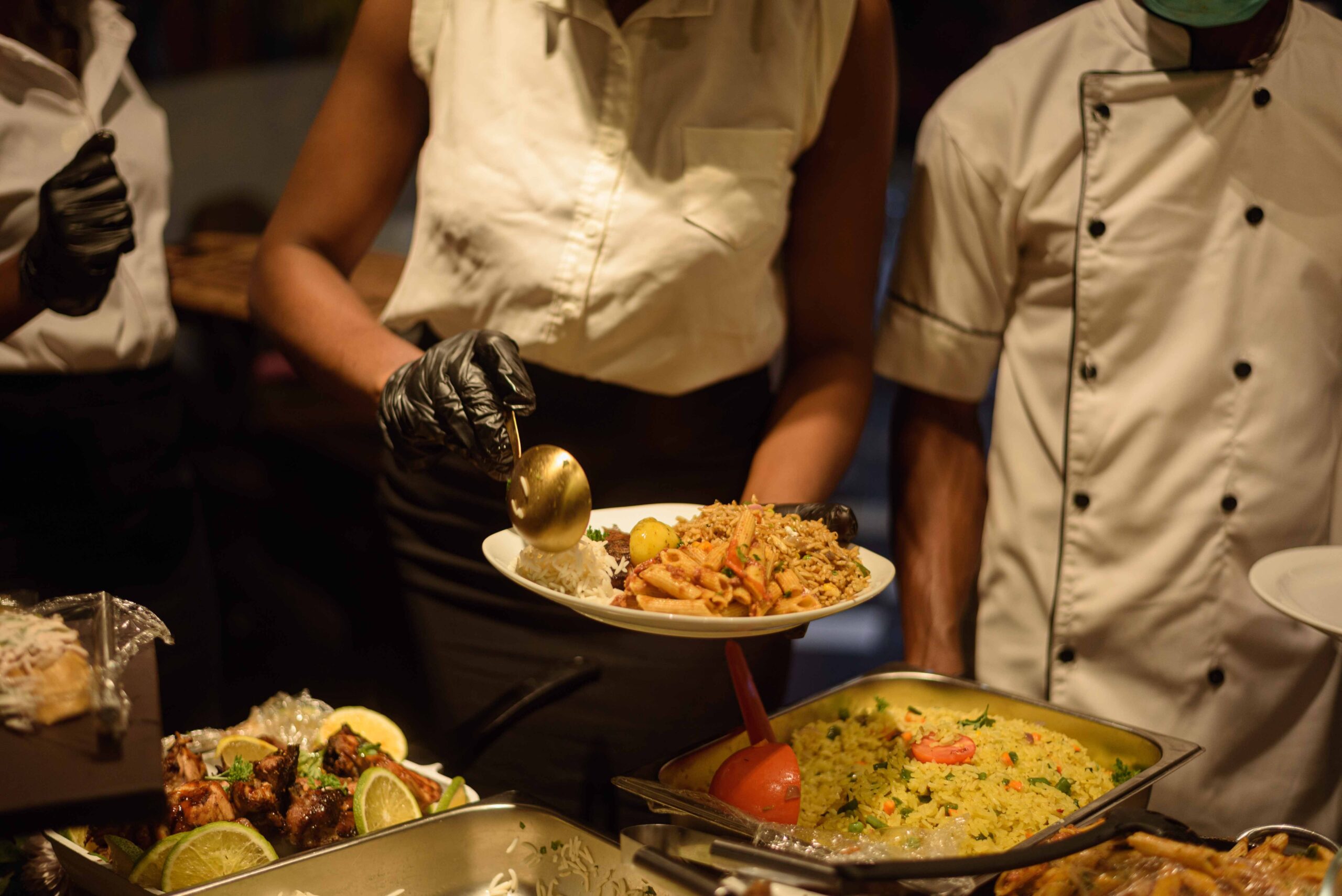 A lady serving food in a birthday event